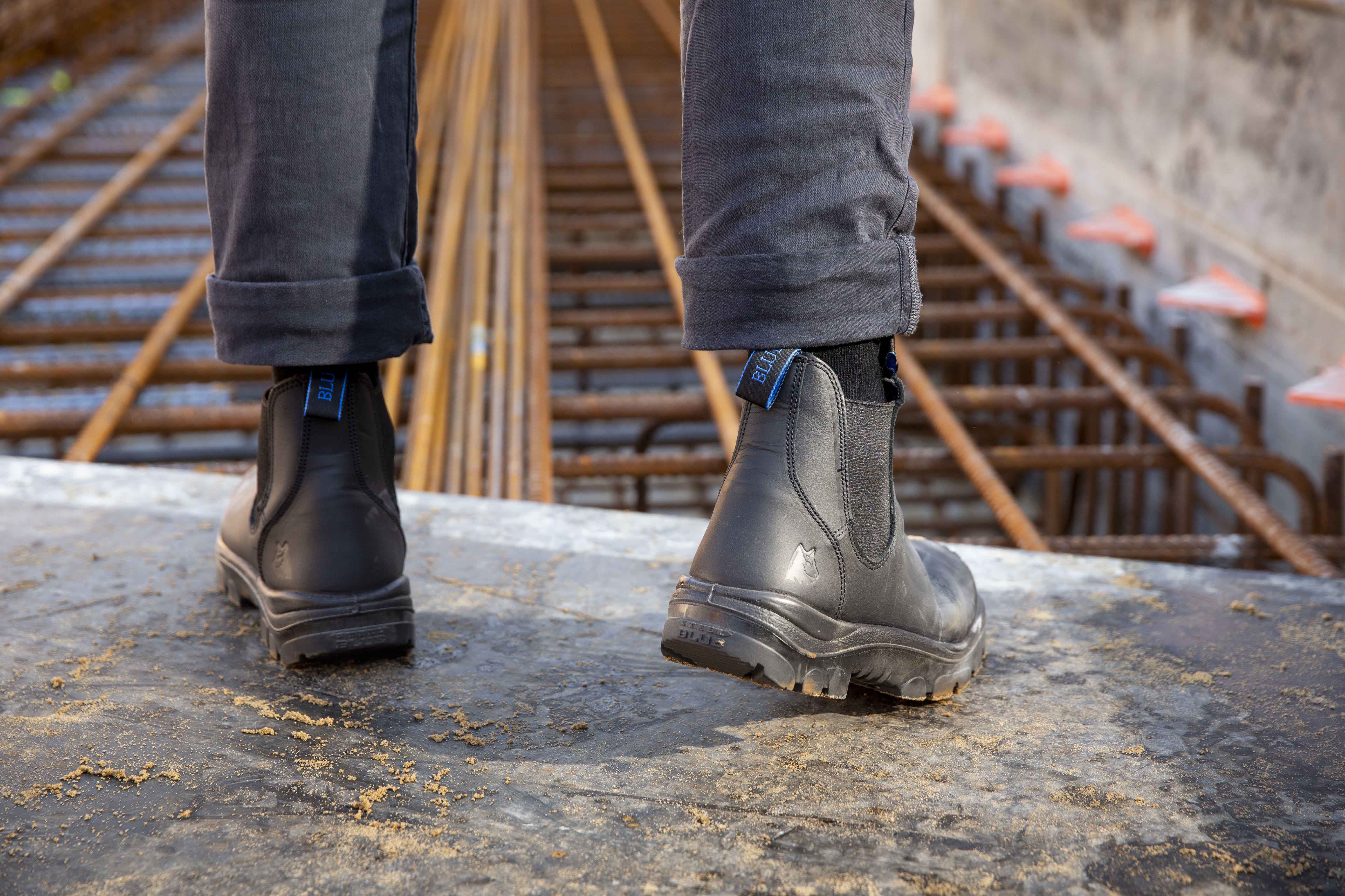 Black boots on building site