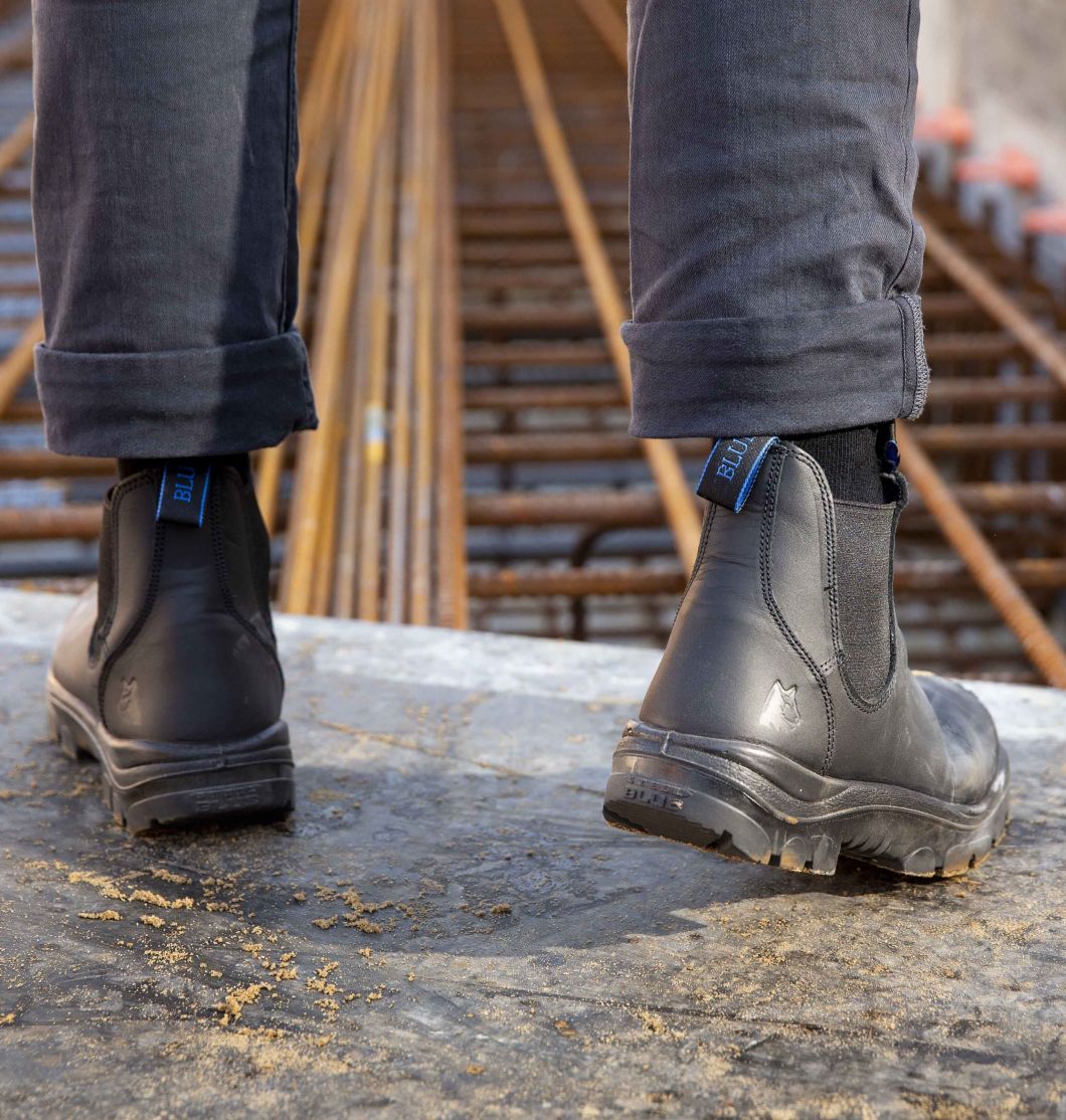Black boots on building site