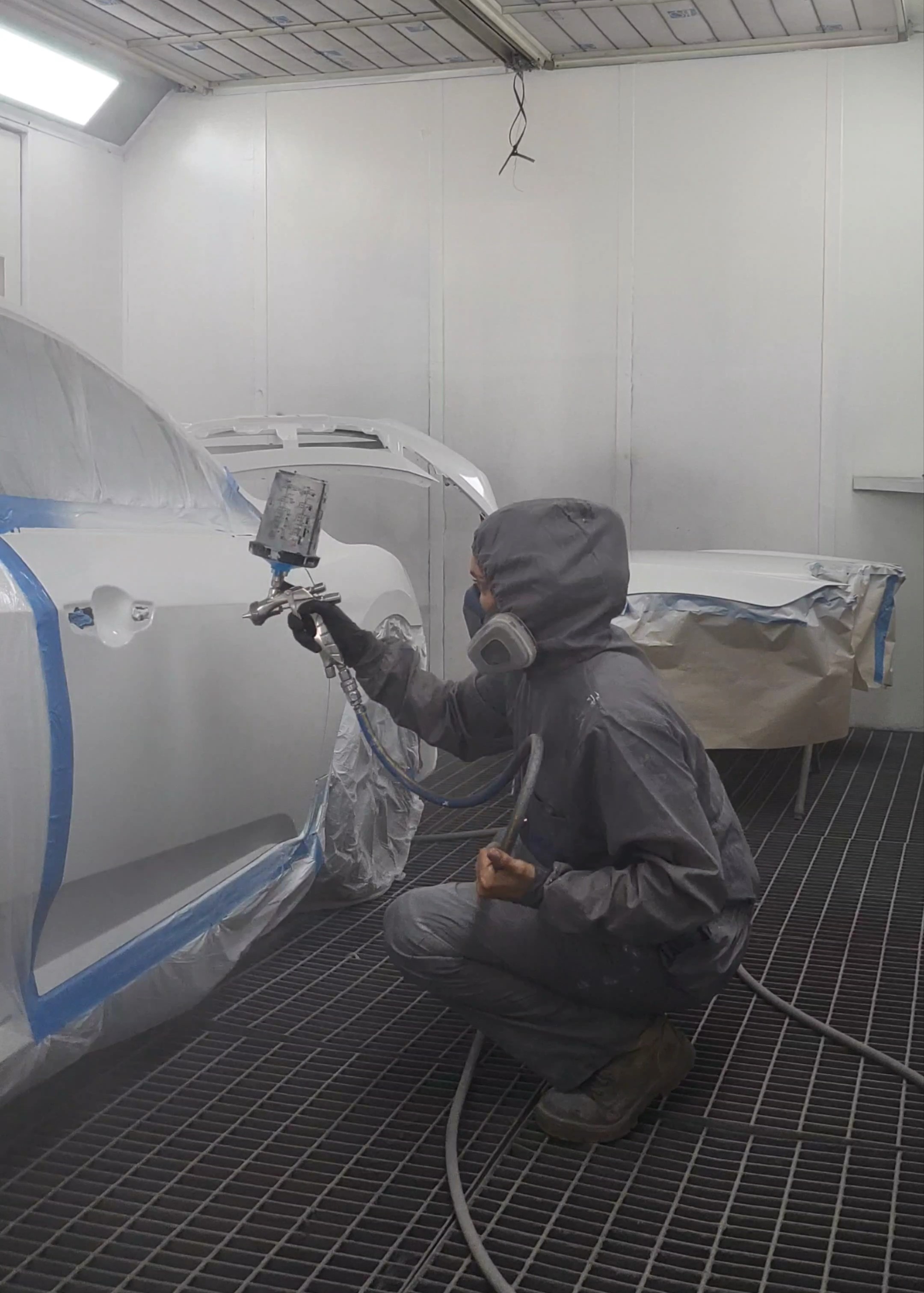 Maddie spraying a car