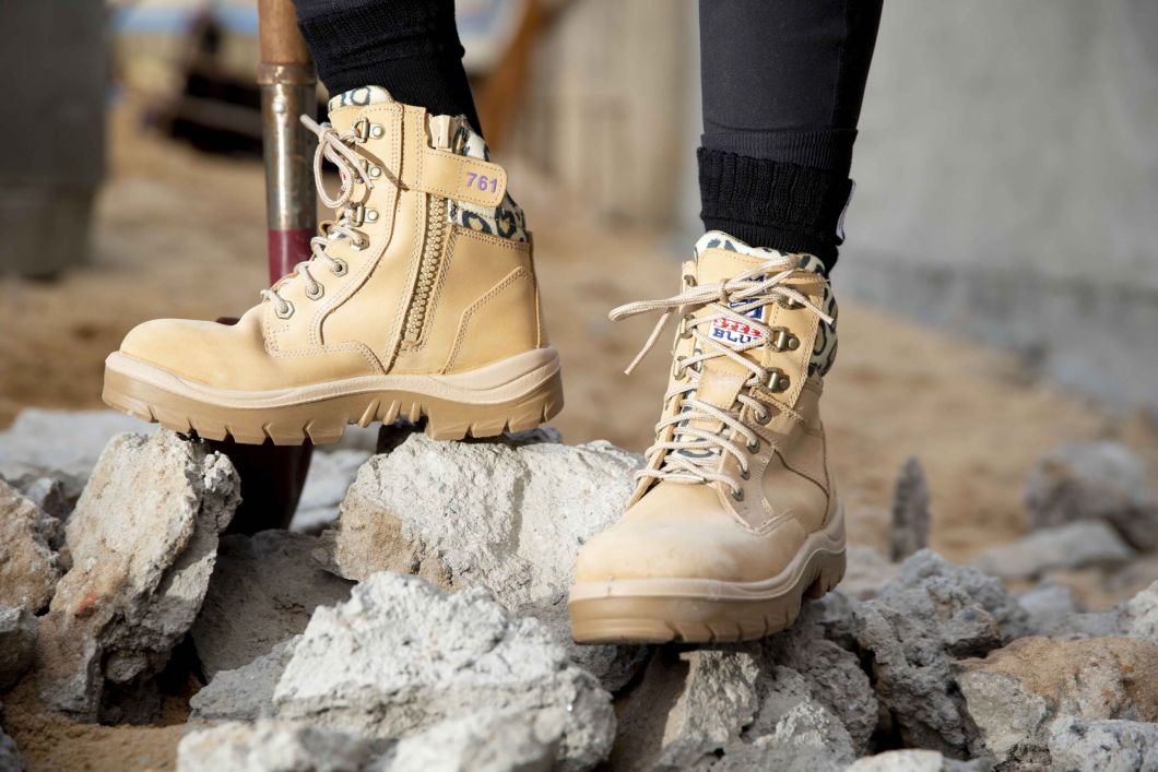 Standing on rocks wearing the Southern Cross® Zip Ladies: Jungle Boots