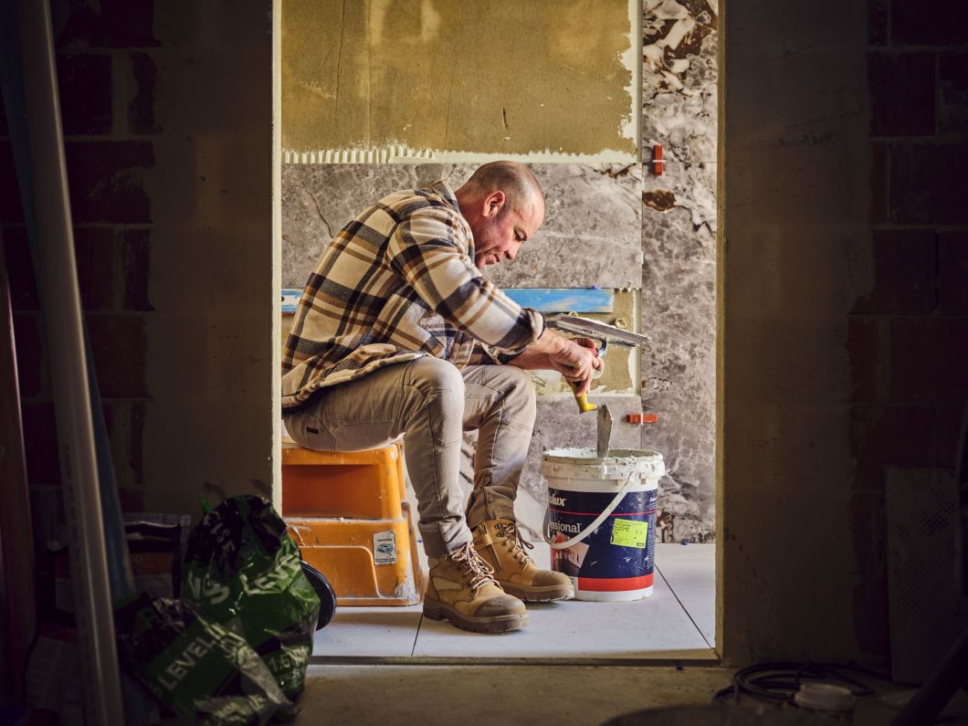 tradie wearing safety boots while