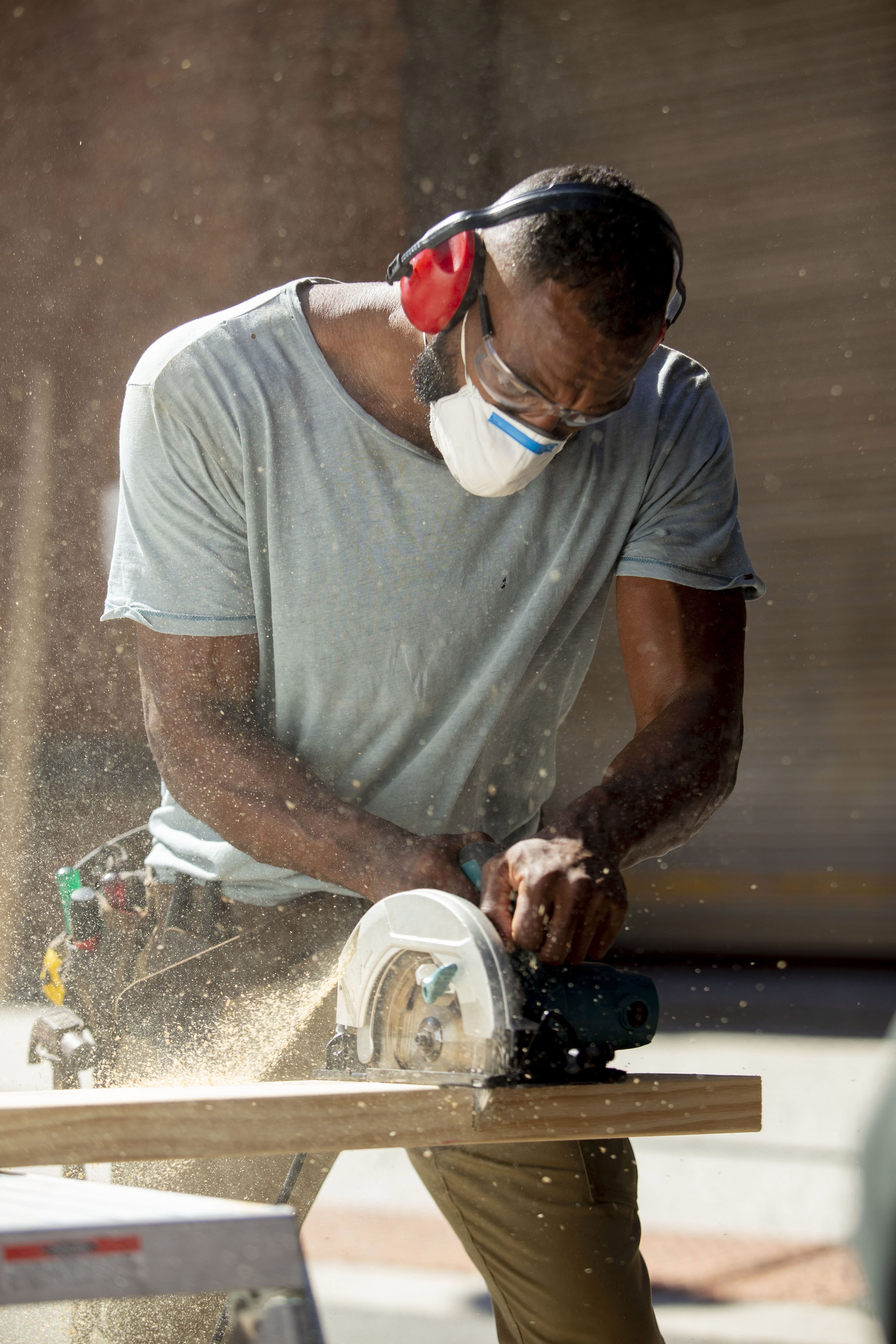 male carpenter woodworking